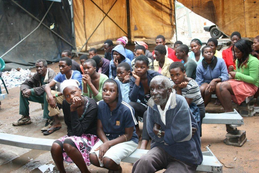 Mazwi community captured following the proceedings of the puppetry show